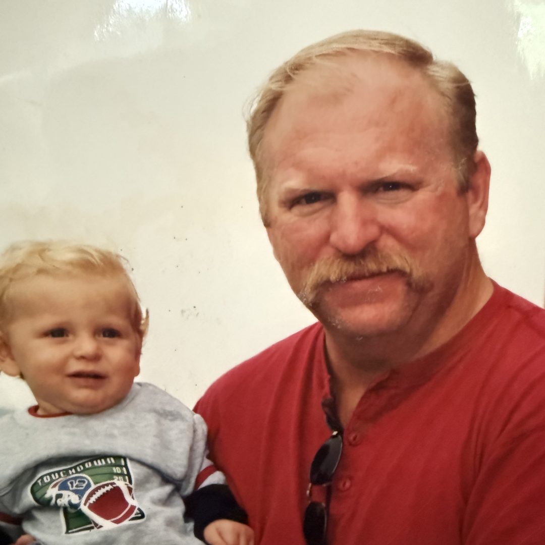 Vince as a baby with his father.