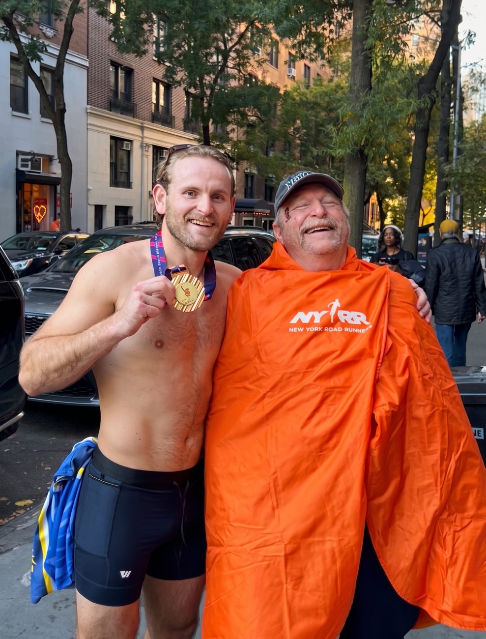 Vince and his father after the 2025 New York City Marathon.